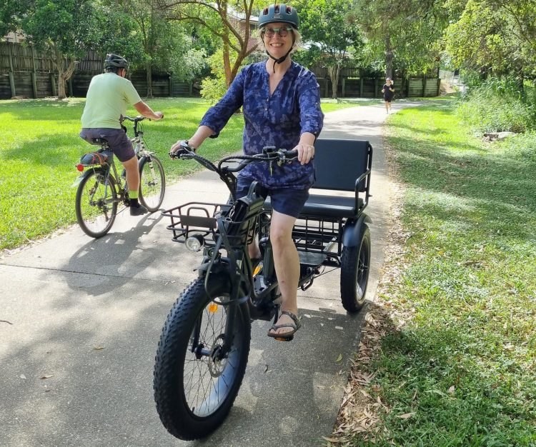TrojanFamilyElectricTricycle-black-withARider-freedomsolutions